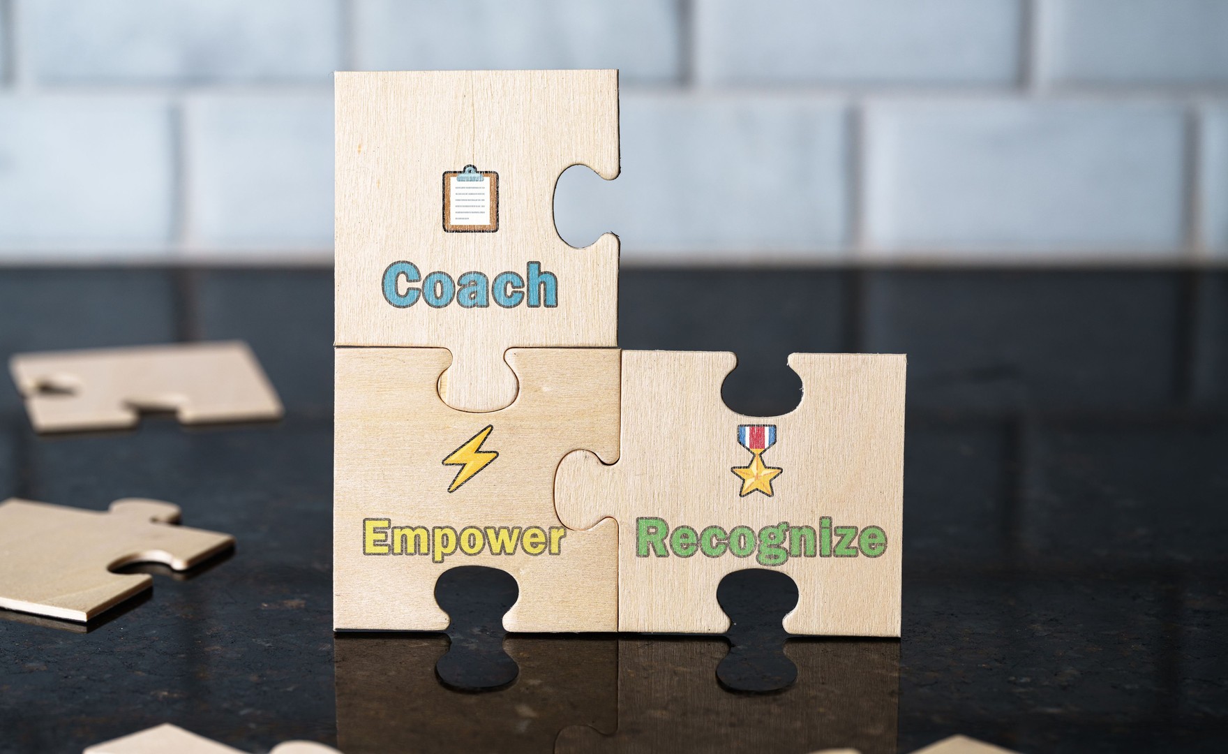 Coach, empower, recognise - leadership culture symbolism