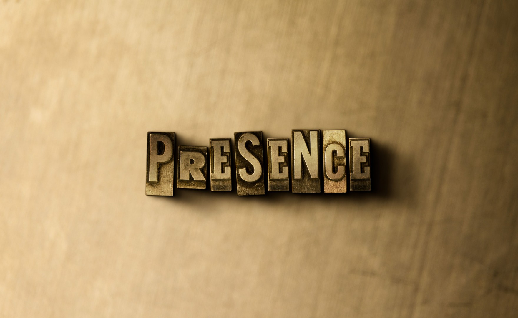 PRESENCE - close-up of grungy vintage typeset word on background