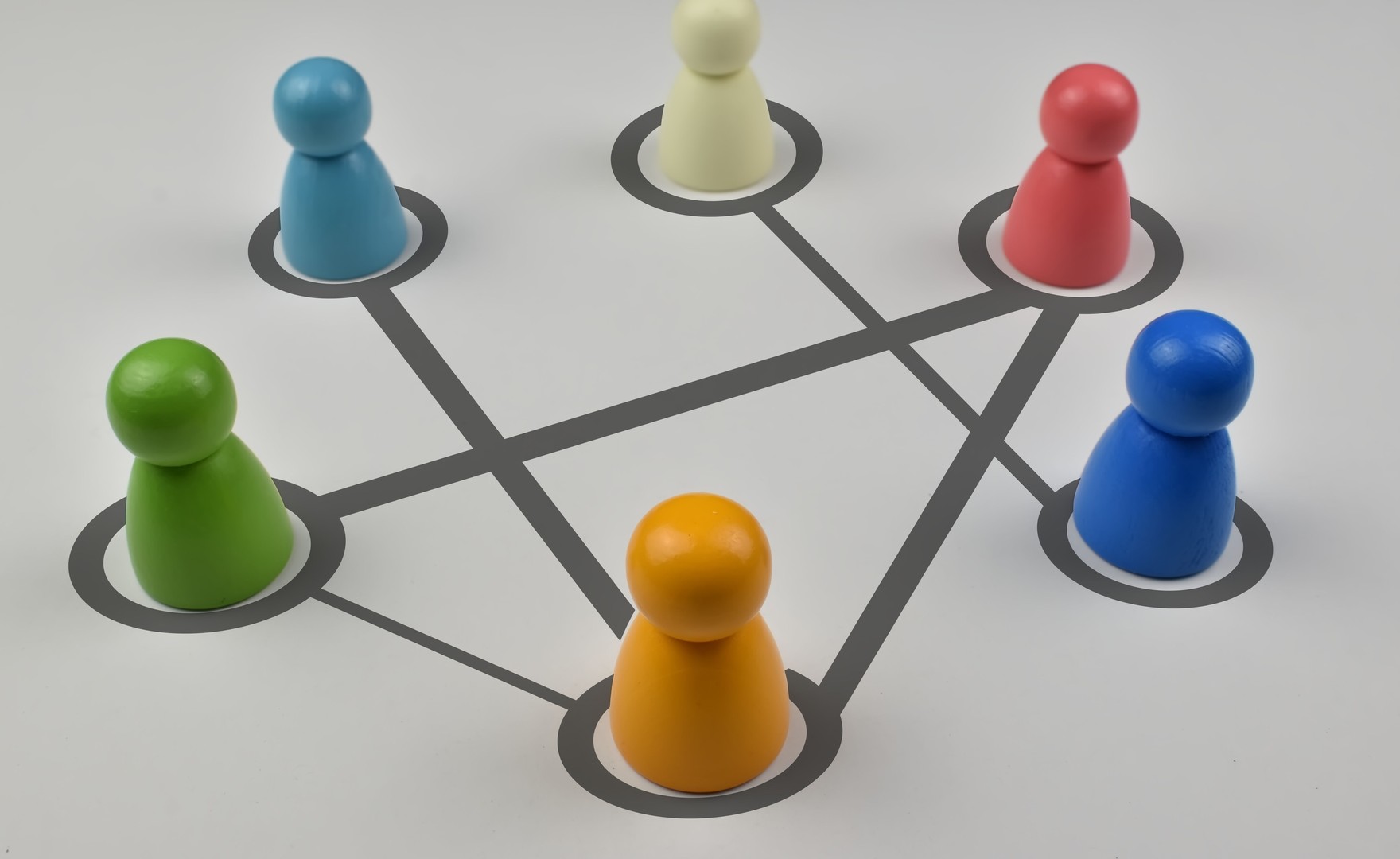 Wood peg people and network lines as a symbol of communication