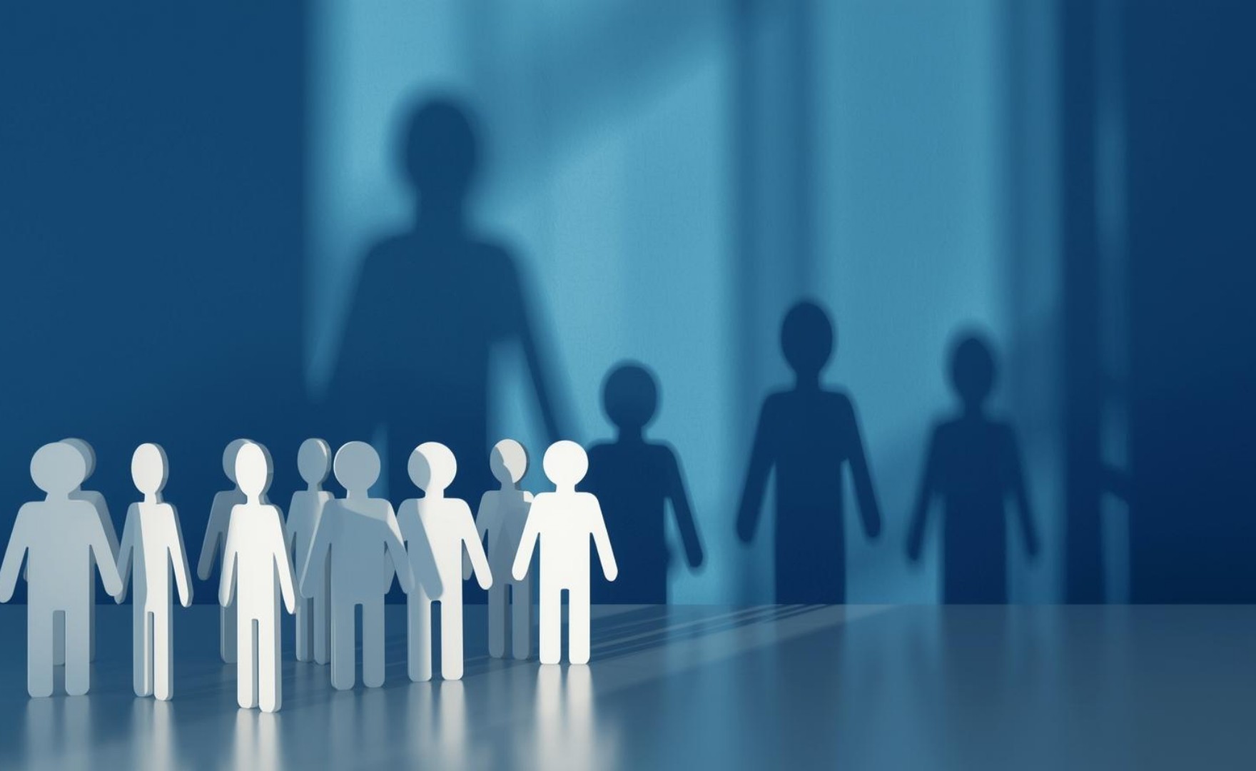 Image of paper chain people and their shadows