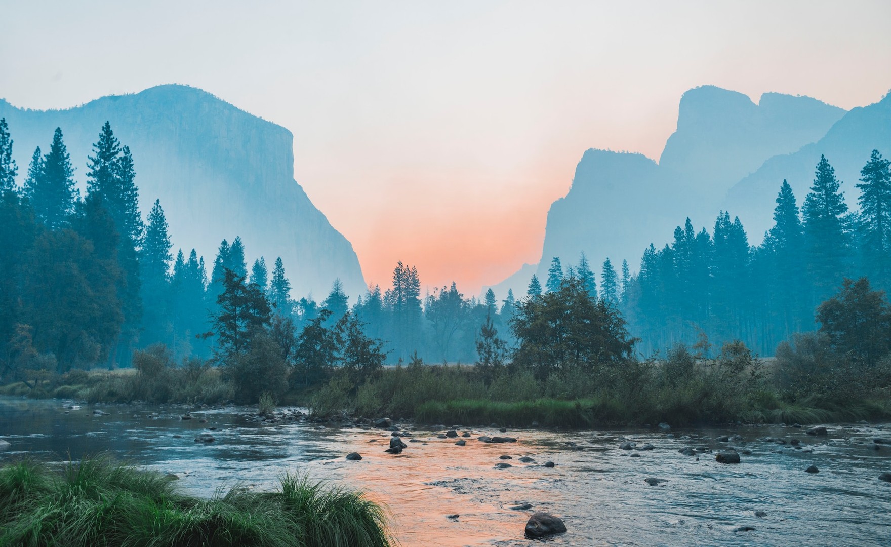 Photo showing serene mountain scene in front of lake