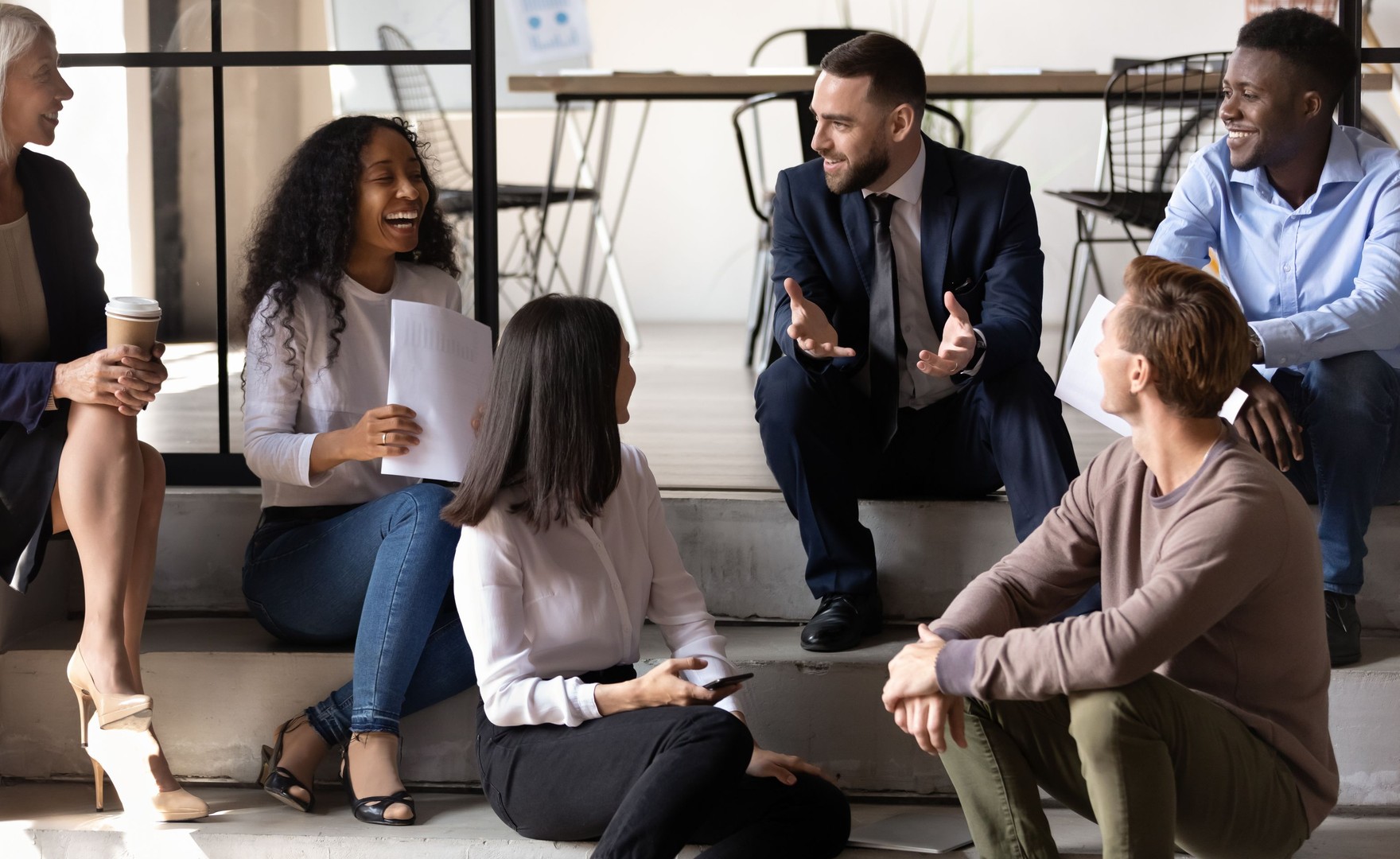 Image of diverse coworkers chatting